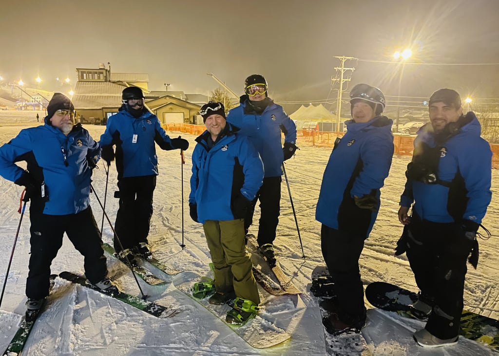 Group of Shawnee workers skiing and snowboarding