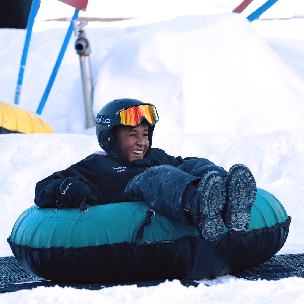 Child snowtubing with a smile!