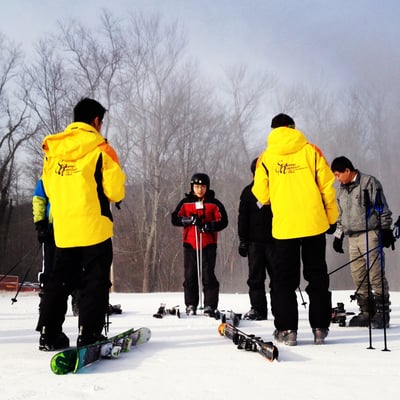 Instructors given a ski lesson.